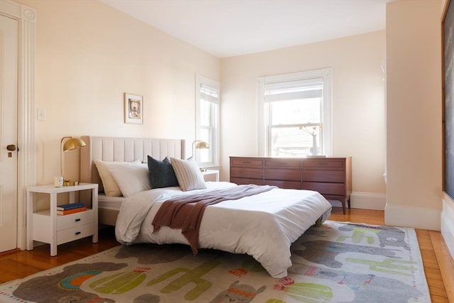 bedroom with wood-type flooring