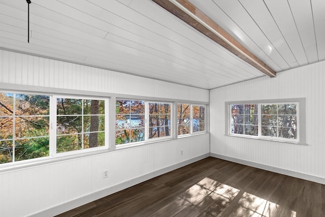 unfurnished sunroom featuring beamed ceiling