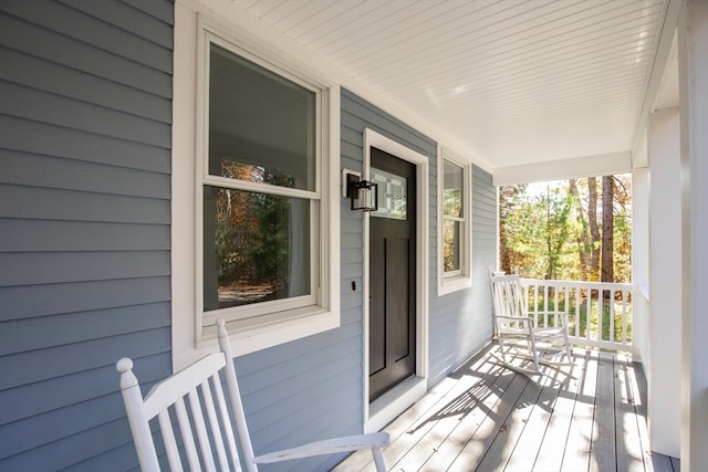 wooden terrace with a porch