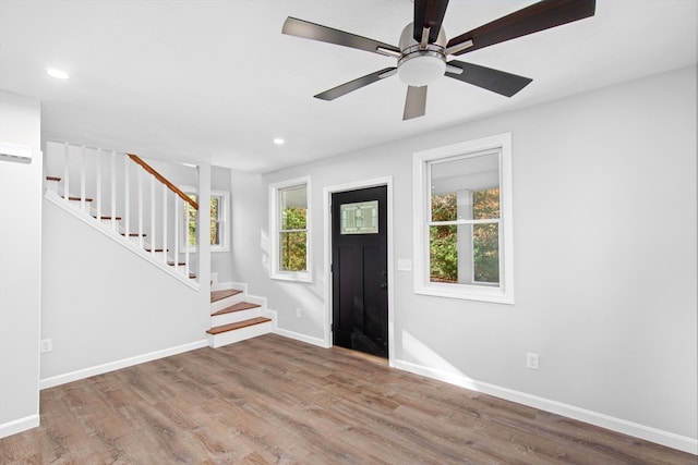 entrance foyer with hardwood / wood-style floors and ceiling fan