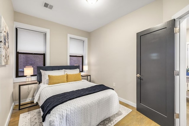 bedroom with light wood-type flooring