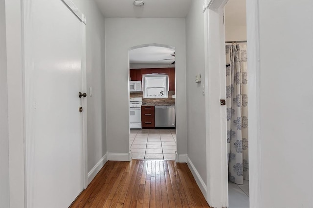 hall with light wood-type flooring