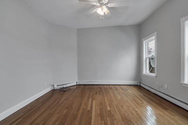 unfurnished room with light wood-type flooring, ceiling fan, and a baseboard heating unit