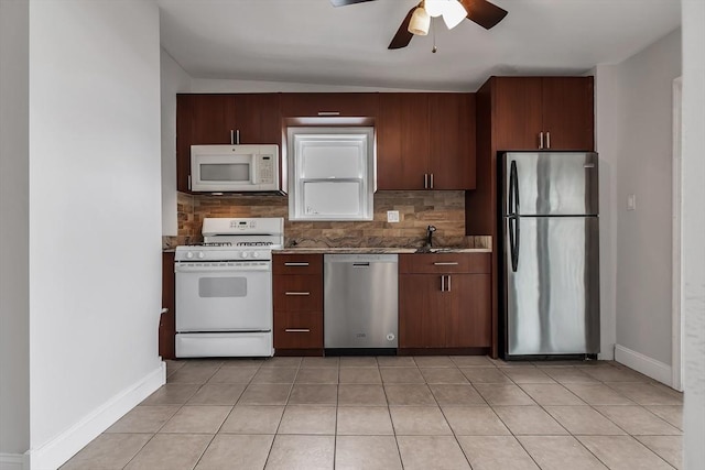 kitchen with ceiling fan, light tile patterned flooring, stainless steel appliances, and tasteful backsplash