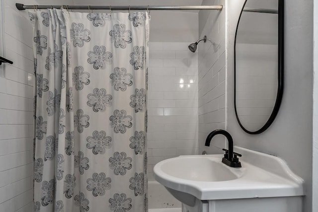 bathroom with sink and shower / bath combination with curtain