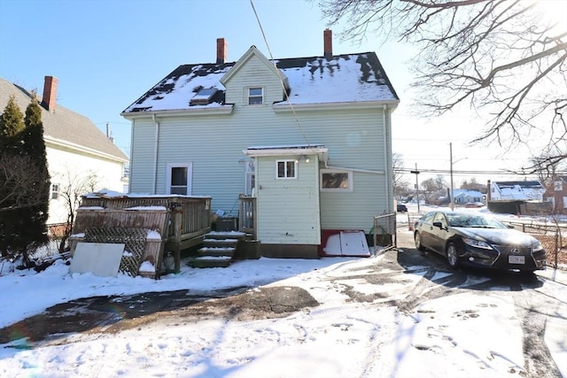 view of snow covered house