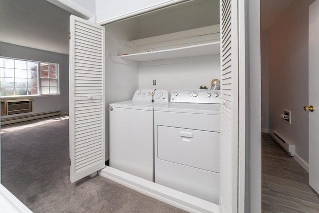 laundry area featuring laundry area, a baseboard radiator, washer and dryer, and a baseboard heating unit