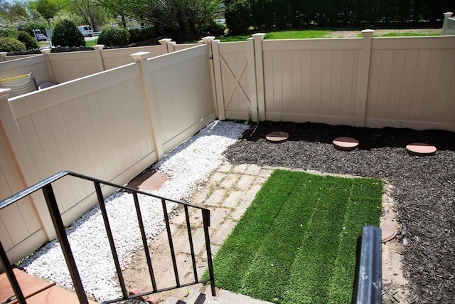 view of yard featuring a gate and fence