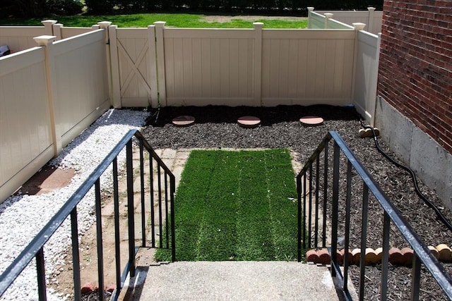 view of yard with a gate and fence