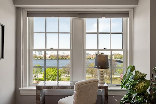 interior space featuring a water view and a wealth of natural light