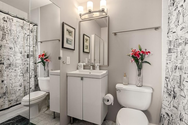 full bathroom featuring toilet, marble finish floor, vanity, and a shower with curtain