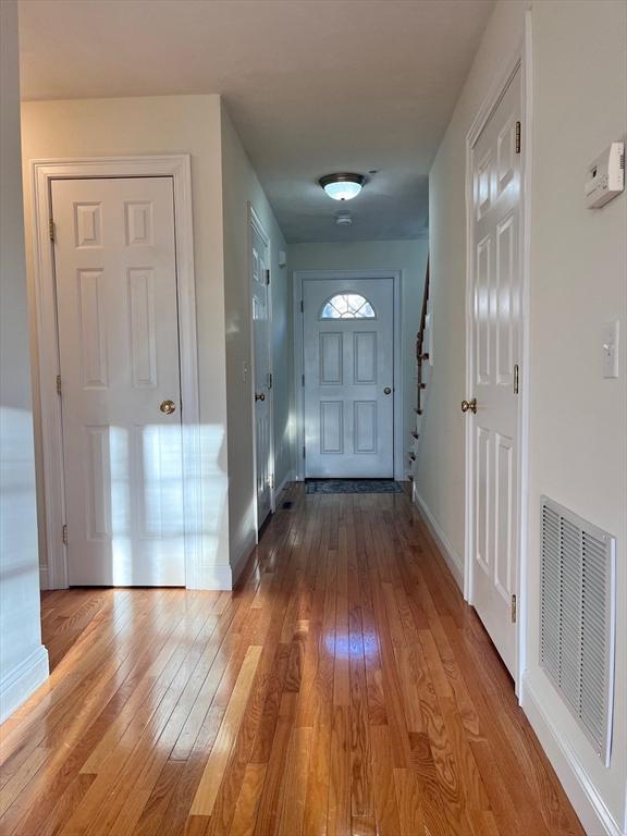 entryway with light hardwood / wood-style flooring