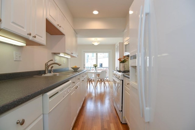 67 School St, Boston, MA 02129 - kitchen featuring white appliances, white cabinetry, light wood-type flooring, dark countertops, and recessed lighting
