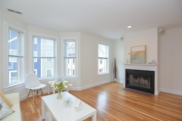 67 School St, Boston, MA 02129 - living area with light wood-style floors, a fireplace with flush hearth, and recessed lighting
