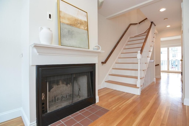 67 School St, Boston, MA 02129 - staircase with wood finished floors, a fireplace with flush hearth, and recessed lighting
