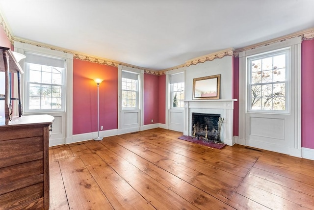 unfurnished living room featuring hardwood / wood-style floors