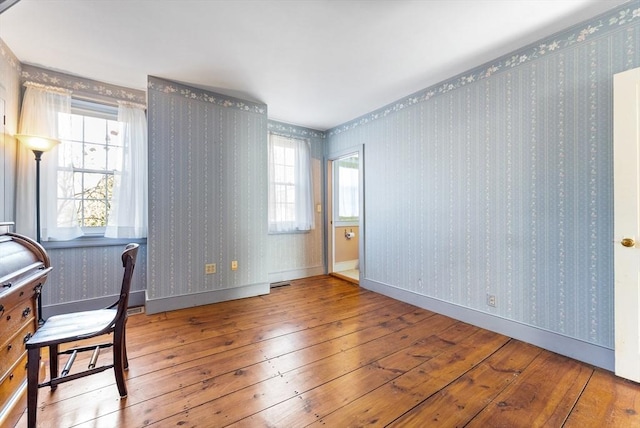 unfurnished office featuring hardwood / wood-style floors