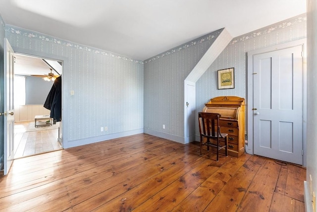 bonus room with light hardwood / wood-style flooring and ceiling fan