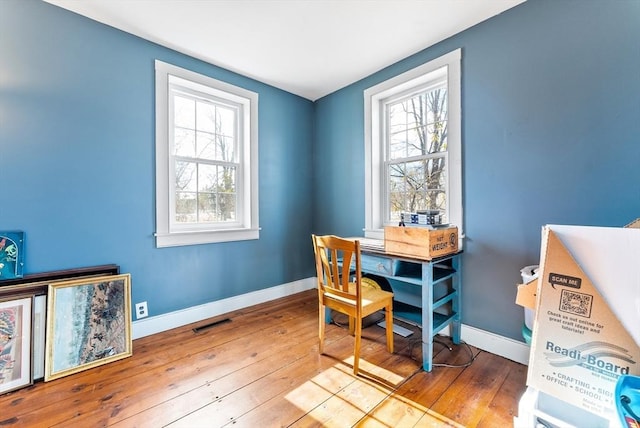 office area with light hardwood / wood-style flooring