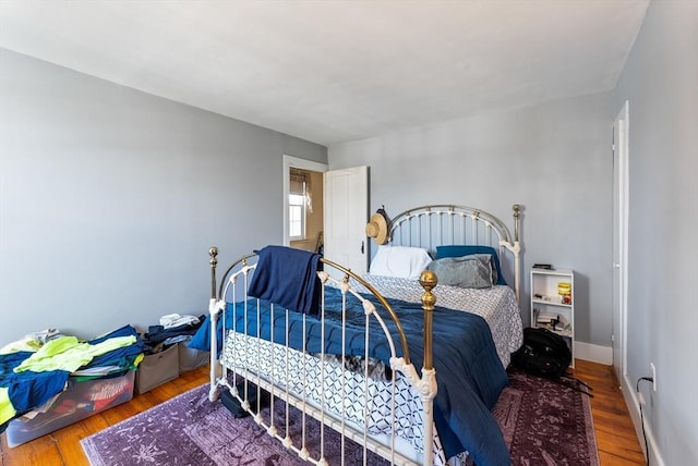 bedroom with wood-type flooring