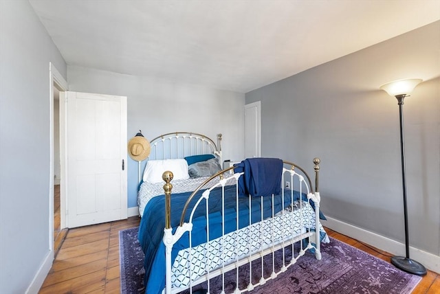 bedroom with wood-type flooring