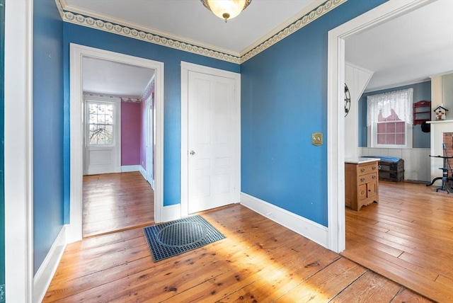 foyer featuring hardwood / wood-style flooring and ornamental molding