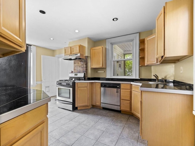 kitchen featuring light brown cabinetry, sink, and stainless steel appliances