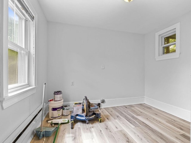 empty room with light hardwood / wood-style flooring