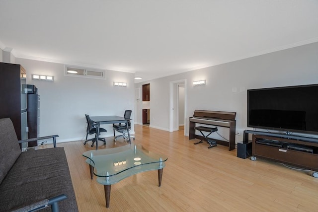 566 Commonwealth Ave Unit 906, Boston, MA 02215 - living room featuring crown molding, light wood-style flooring, and baseboards