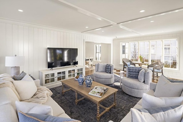 living room with crown molding and coffered ceiling