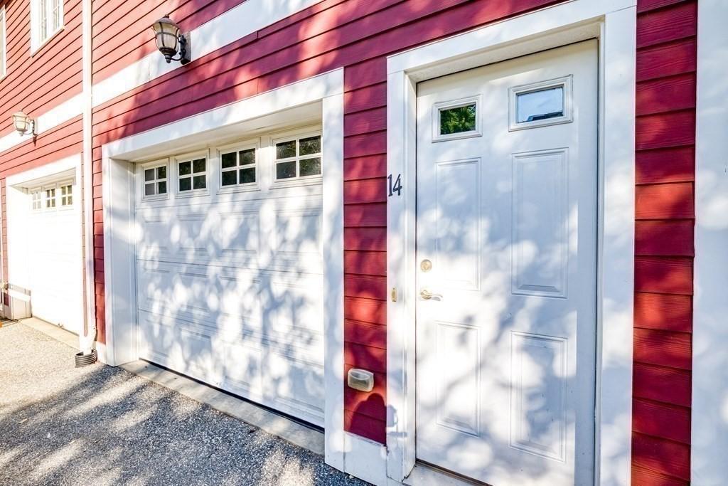 40 Brattle Unit 14, Arlington, MA 02476 - garage featuring gravel driveway