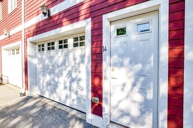 40 Brattle Unit 14, Arlington, MA 02476 - garage featuring gravel driveway