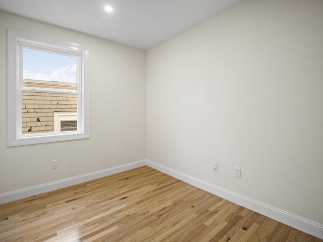 spare room featuring light hardwood / wood-style floors