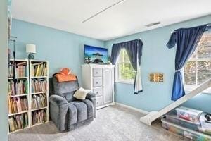84 E Ave, Lowell, MA 01854 - living area with carpet floors and baseboards