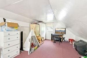 84 E Ave, Lowell, MA 01854 - playroom featuring lofted ceiling and carpet floors