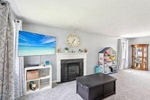 84 E Ave, Lowell, MA 01854 - living area with carpet flooring and a fireplace
