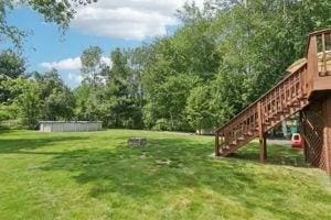 84 E Ave, Lowell, MA 01854 - view of grassy yard featuring stairway