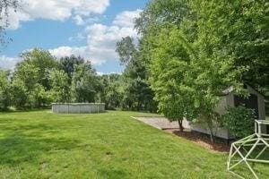 84 E Ave, Lowell, MA 01854 - view of grassy yard with a swimming pool