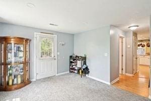 84 E Ave, Lowell, MA 01854 - foyer entrance featuring baseboards