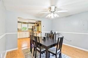 84 E Ave, Lowell, MA 01854 - dining room featuring a ceiling fan, light wood-style floors, and baseboards
