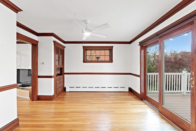unfurnished room with a ceiling fan, a baseboard heating unit, ornamental molding, and light wood-type flooring