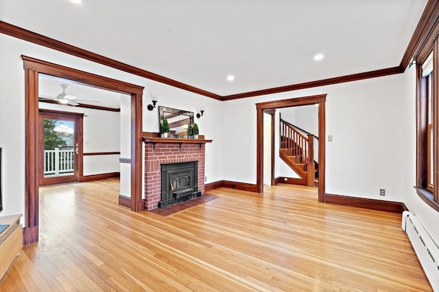 unfurnished living room featuring crown molding, light wood-type flooring, stairway, baseboards, and a baseboard radiator