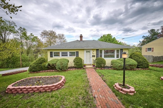 view of front of house featuring a chimney