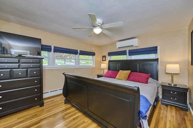 bedroom with an AC wall unit, a baseboard radiator, light wood-type flooring, a ceiling fan, and baseboards