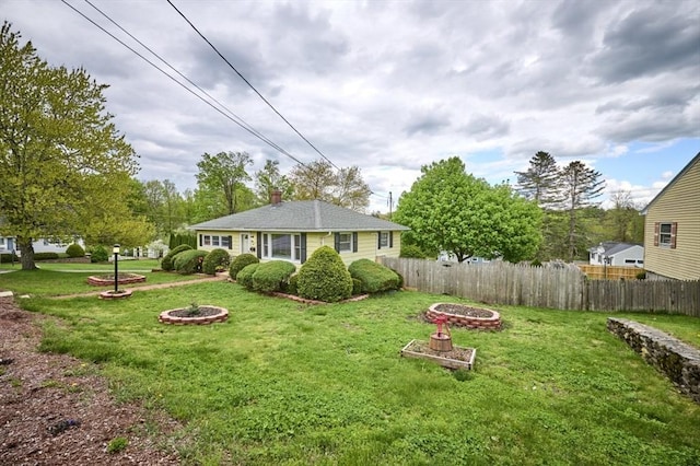 view of yard featuring a fire pit