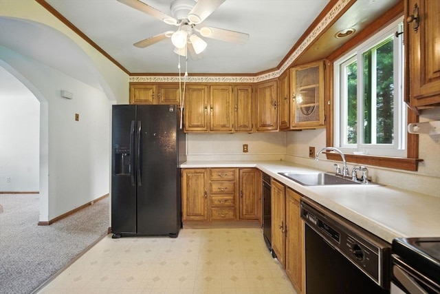 69 Michael St, Ludlow, MA 01056 - kitchen featuring black appliances, brown cabinets, arched walkways, ceiling fan, and light countertops