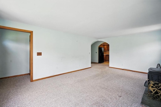 69 Michael St, Ludlow, MA 01056 - unfurnished living room featuring arched walkways and light carpet