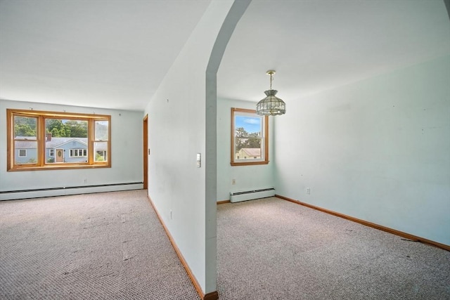 69 Michael St, Ludlow, MA 01056 - carpeted spare room with a baseboard radiator, healthy amount of natural light, and a chandelier