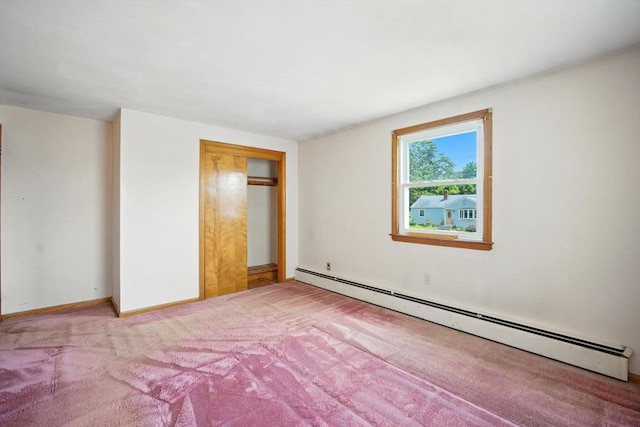69 Michael St, Ludlow, MA 01056 - unfurnished bedroom with a baseboard heating unit, carpet flooring, and a closet