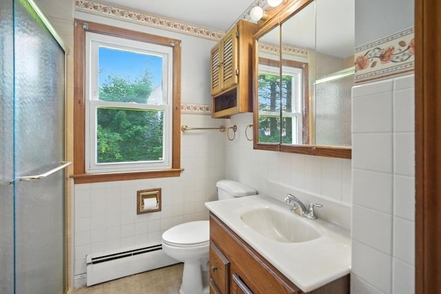 69 Michael St, Ludlow, MA 01056 - bathroom with baseboard heating, tile walls, a shower stall, and vanity